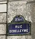 Traces d'ancien nom de la rue (on devine ici « Rue Neuve-Saint-François »).