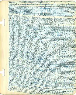 Page de cahier unie couverte d'une écriture fine et serrée dans une encre bleu clair