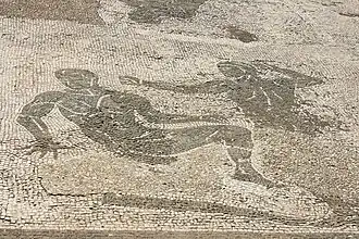 Mosaïque des thermes de Neptune à Ostie, salle 12. Le combat de pancrace se continue au sol.