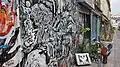 Fresque peinte sur les murs de la rue Dénoyez