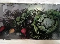 Peinture sur verre sur l'une des portes du château : des légumes
