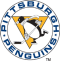 Logo représentant un manchot patinant avec un bâton de hockey et un foulard, entouré des mots PITTSBURGH PENGUINS.