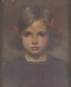 Petite fille aux nœuds rouges