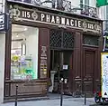 No&nbsp;115 : pharmacie réputée la plus ancienne de Paris (voir agrandissement du panneau explicatif).