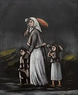 Une femme et ses enfants vont à la source.