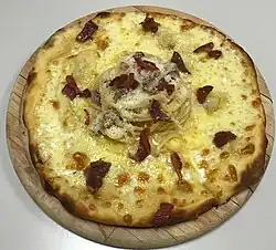 a plate half full of pizza, half full of spaghetti