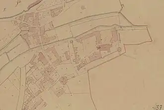 Image en couleurs représentant le plan au sol de constructions urbaines.