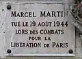Plaque au no 221, en hommage à Marcel Martin, tué pour la Libération de Paris (1944).