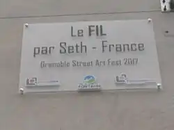 Plaque sous le fresque de Seth, à Fontaine, apposée en 2017.