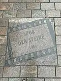 Plaque du film La Trace des pierres 1966, Potsdam, Brandenburger Straße.