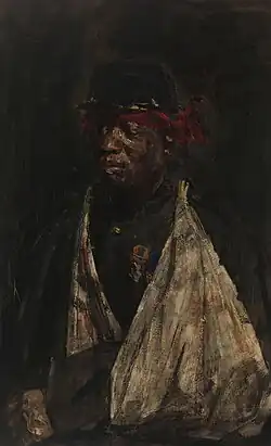 Portrait d'un soldat noir avec un bras en écharpe et un bandana rouge autour du front. Il porte deux médailles sur son uniforme militaire.