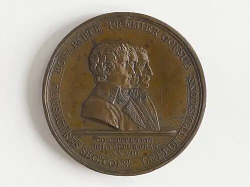 Avers avec le profil des trois consuls : Bonaparte, Cambacérès et Lebrun.