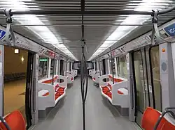 Vue intérieure d'une remorque (2de&nbsp;rénovation), où la disposition des sièges a été modifiée.