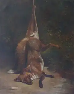 Nature morte, un renard pendu par une patte