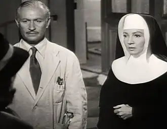 Avec Robert Douglas dans Tempête sur la colline (1951).
