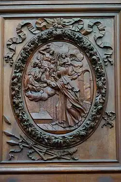 Relief sur bois, basilique Sainte Marie-Madeleine de Saint-Maximin-la-Sainte-Baume. Le Christ offre trois flèches à la bienheureuse, l'un de ses attributs.