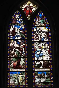 Photographie d'un vitrail ancien à deux lancettes.