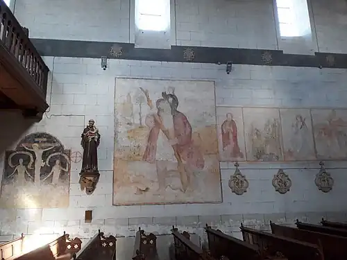 Saint Christophe début 16e à sa place traditionnelle près de l'entrée.