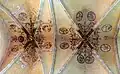 La voûte peinte et les clés de voûte Renaissance.