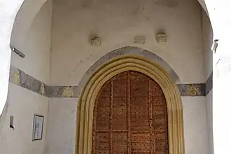 Portail d'entrée, litre funèbre de Castanier IV baron de Couffoulens