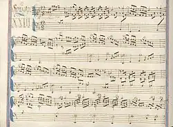 partition manuscrite rehaussée de couleurs passées bleu et rouge en bordures