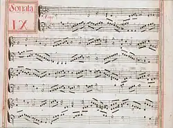 partition manuscrite aux couleurs passées rouge et vert en bordures et cadre de titre, titre en rouge