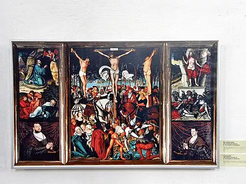 Polyptyque ouvert : panneau central entouré des panneaux centraux déployés, mais sans la prédelle.