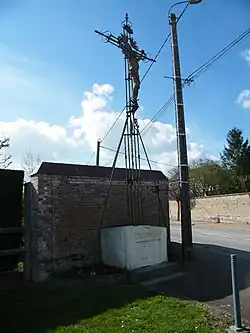 Croix de mission de 1882, dans le village.