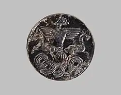 Sceau-cachet représentant un rapace tenant deux animaux à cornes avec ses serres. Anatolie, Bronze moyen, Metropolitan Museum.