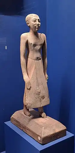 Statuette d'homme debout. Bois (traces de peinture). Modèle. Moyen Empire (environ 2033-1786 avant l'ère commune). Gizeh.