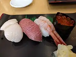 Hotategai, maguro-toro, ama ebi, ikura sushi.