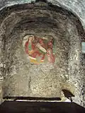 Vierge à l'Enfant juste né, fresque ayant donné son nom au lieu.