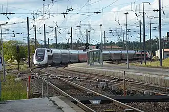 Départ d'un TGV Lyria, à destination de Paris.