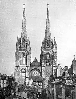 Gravure représentant un édifice religieux dominé de deux flèches.