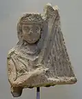 Terre cuite représentant un joueur de harpe, musée du Louvre.
