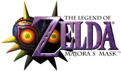 Zelda est inscrit en lettres violettes. Les mentions The Legend of Zelda et Majora's Mask figurent en tout petit en dessus et en dessous. Sur la gauche en arrière-plan, figure une sorte de masque violet en forme de cœur, équipé de pointes, avec des yeux rouges et jaunes.