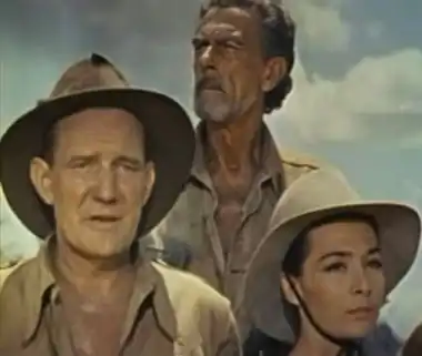 En arrière plan, avec Trevor Howard (à g.) et Juliette Gréco, dans Les Racines du ciel (1958)