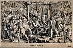 Gravure sur bois. Foule entourant un homme enchaîné couché sur un bûcher allumé