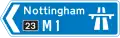 Panneau directionnel indiquant une ville desservie par une autoroute