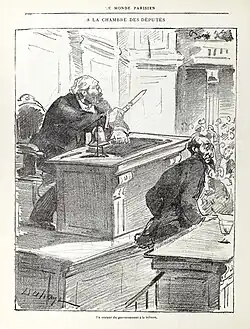 Caricature de presse montrant un homme s'exprimant à la tribune d'une assemblée.