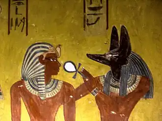 Anubis donnant le souffle de vieà Thoutmôsis IV - KV43 Vallée des Rois.