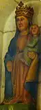 Statue en bois polychrome de la Vierge à l'Enfant (XIVe&nbsp;siècle) dans une niche située au milieu du chœur de l'ancienne chapelle.