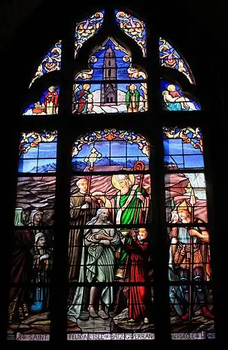 Vitrail montrant un évêque bénissant une foule.