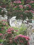 L'enseigne du Jardin vue depuis le Jardin en fleurs.