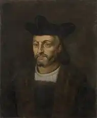 Tableau de la Renaissance montrant le visage d'un homme barbu sur un fond sombre.